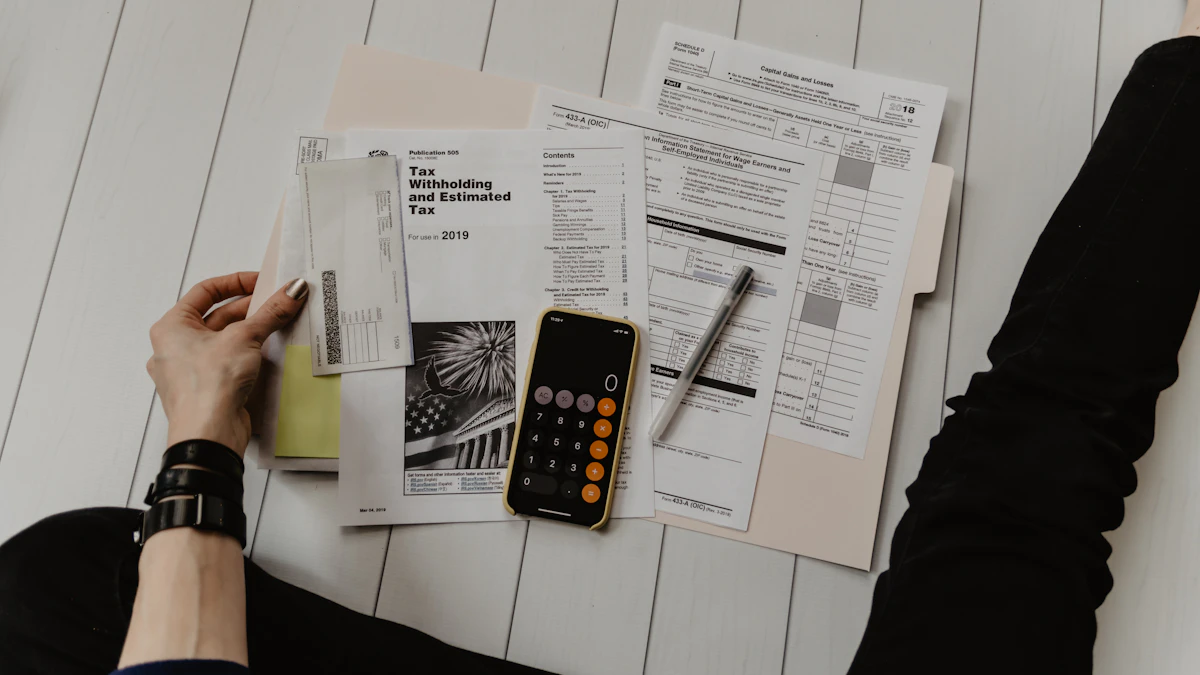 Calculator and financial paperwork used to estimate business expenses