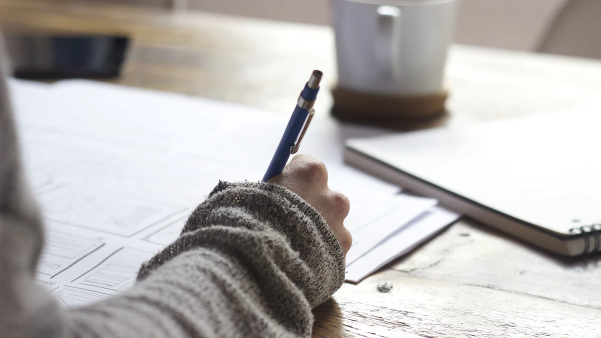 Person writing notes in a planner to organize a business launch